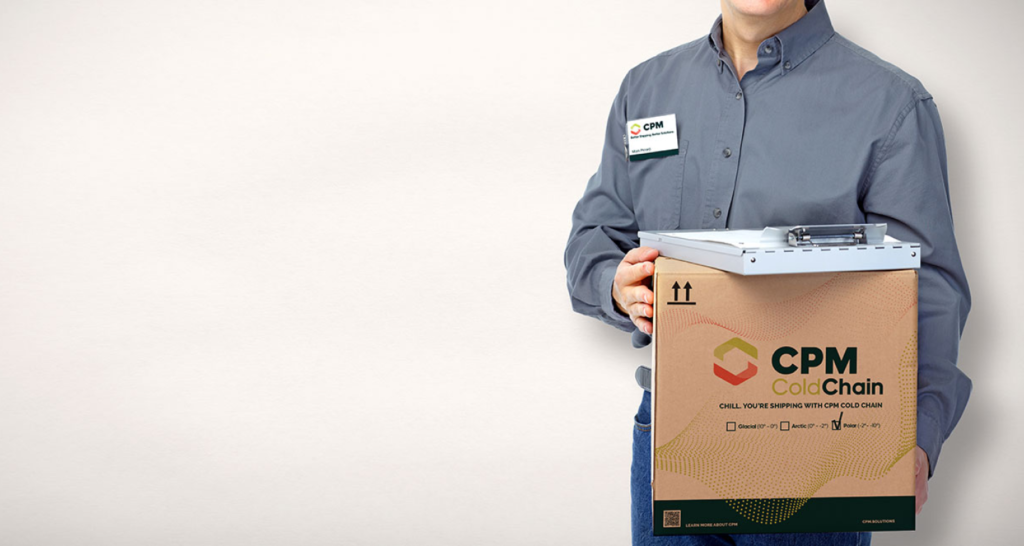 Man in blue shirt holding a CPM shipping box with graphics and logo
