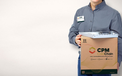 Man in blue shirt holding a CPM shipping box with graphics and logo