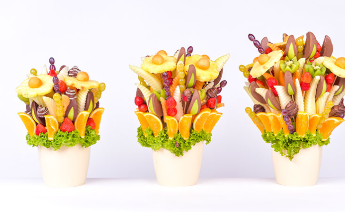 Three sizes of different edible arrangement fruit assortments