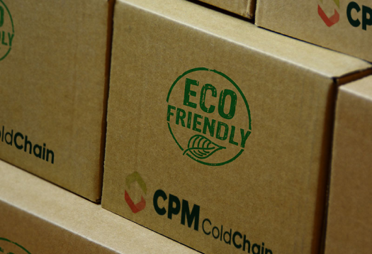 shipping box with green eco-friendly symbol and green and orange CPM Cold Chain logo
